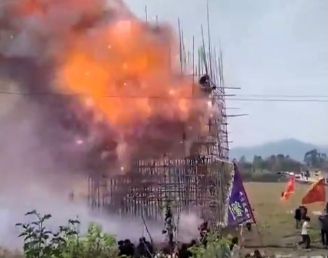 Fireworks mishap at China's Lantern Festival leaves five injured as a bamboo display ignites in a shocking explosion, with workers jumping to escape the flames.