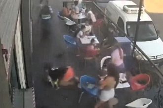 A fleeing biker in Buenos Aires rammed a mother holding her baby and two children outside an ice cream shop while escaping a police stop. The suspect remains at large.