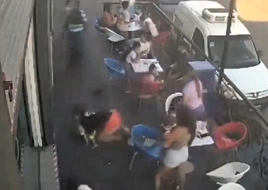 A fleeing biker in Buenos Aires rammed a mother holding her baby and two children outside an ice cream shop while escaping a police stop. The suspect remains at large.