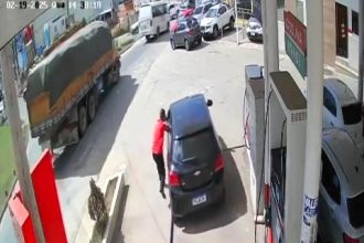 A petrol station worker in Brazil was dragged by a fleeing driver but escaped unharmed. The suspect crashed into a vehicle and was later arrested by police.