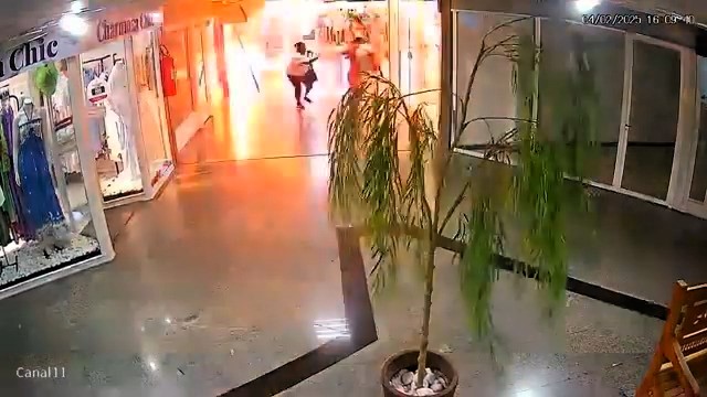 A jealous woman in Brazil faces attempted murder charges after allegedly blowing up her husband's alleged lover's shop in a mall, injuring four and sparking chaos.