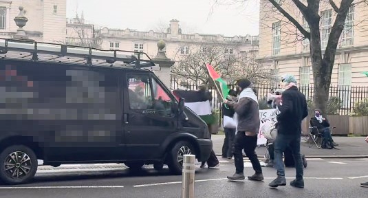 A van drove into a crowd of pro-Palestine protesters blocking a road outside Cardiff University, knocking one person over. Police are investigating the incident.
