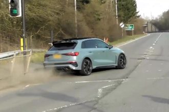 Audi driver loses control near Alderley Edge, scraping a barrier at a notorious roundabout. The luxury car survived with minor damage in the high-profile area.