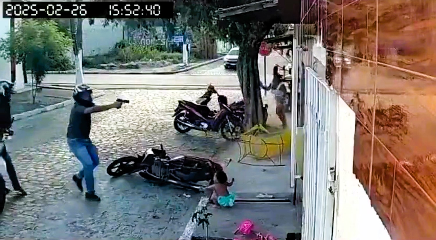 A baby miraculously survived a shooting in Brazil as gunmen fired over 15 shots at her father. The tot was caught in the crossfire but was unharmed.