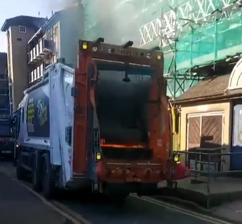 A bin lorry in Bethnal Green burst into flames after dumped e-bike batteries ignited - forcing firefighters to intervene as locals slammed the reckless disposal of hazardous waste.
