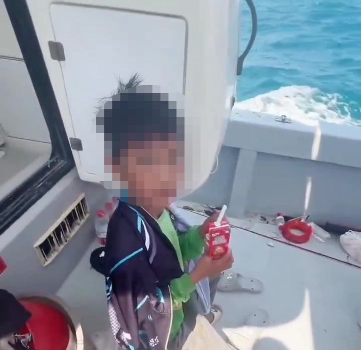 A 10-year-old boy drifted out to sea on a solo squid fishing trip and spent the night alone before being rescued by a passing boat off the coast of southern China.