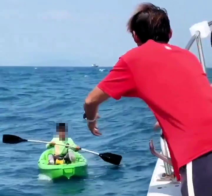 A 10-year-old boy drifted out to sea on a solo squid fishing trip and spent the night alone before being rescued by a passing boat off the coast of southern China.