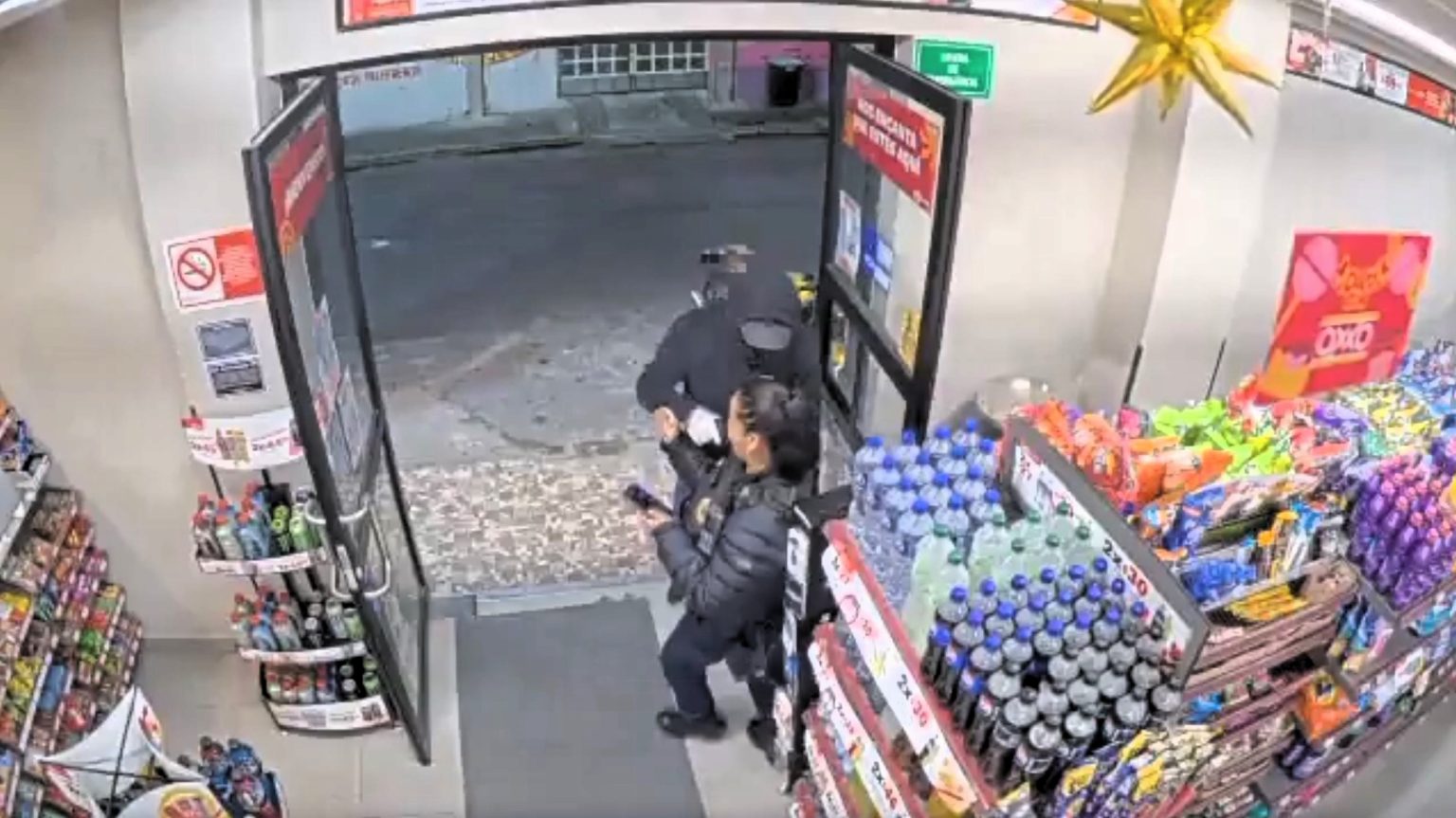 A police officer in Mexico City was robbed at gunpoint outside a supermarket, forced to hand over her service weapon - authorities are investigating, but no arrests have been made.