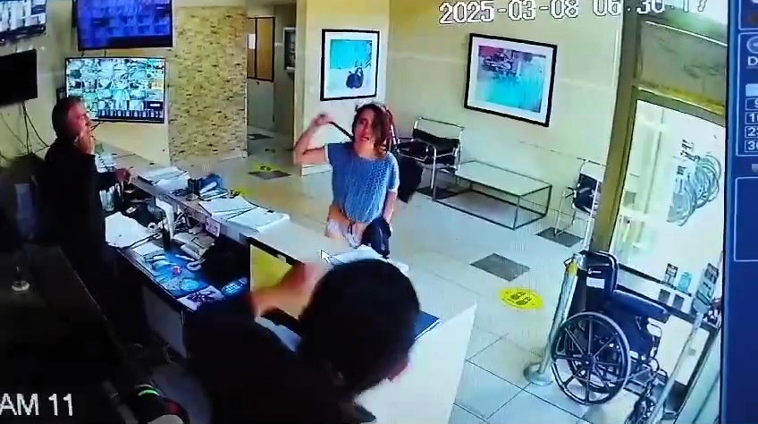 A half-naked woman in Santiago, Chile, attacked a security guard with a dustpan after accusing him of "snitching" on her alleged affair - she was arrested and faces eviction.