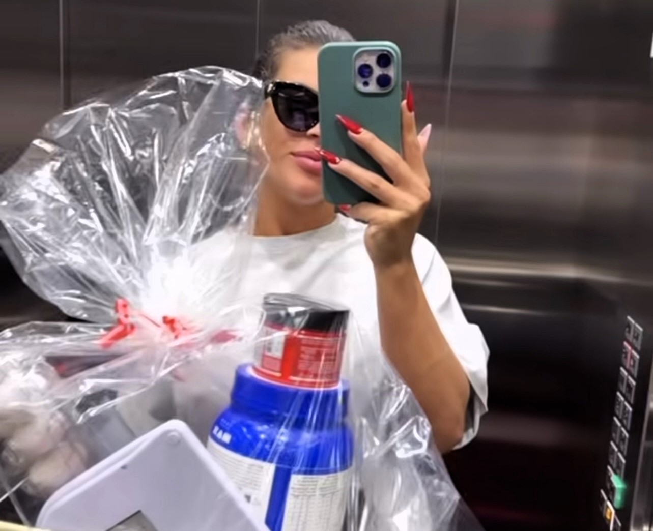 Influencer slammed for gifting pal a fitness basket and scales, sparking backlash. She says it was thoughtful, but critics call it tone-deaf.