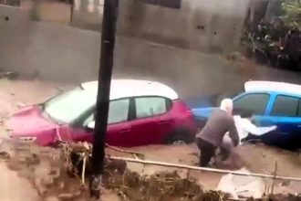 A woman was rescued from her car just seconds before it was swept away by floodwaters in Gran Canaria. Heavy rain caused ravines to overflow, flooding homes and roads.