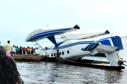 A Peruvian Air Force plane crashed upside down in a river after hitting a hidden sandbank, but all three crew members miraculously survived with only minor injuries.