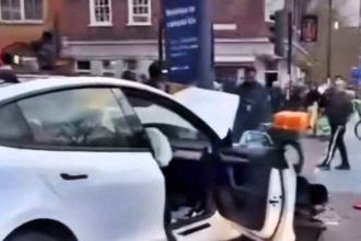 A Tesla crashed into a lamp post and traffic lights in east London, injuring seven people, with two rushed to a major trauma center in a dramatic emergency response.