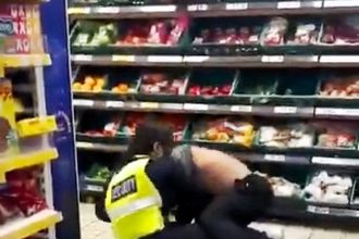 A brave Tesco security guard tackled a wine thief in front of shocked shoppers. The crook escaped after 50 seconds, but locals praised the guard's heroic effort.