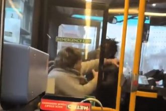 Two men brawled on a packed bus in Uxbridge as shocked passengers watched. The fight erupted near the door before spilling onto the ground in a chaotic scene.