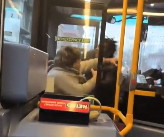 Two men brawled on a packed bus in Uxbridge as shocked passengers watched. The fight erupted near the door before spilling onto the ground in a chaotic scene.