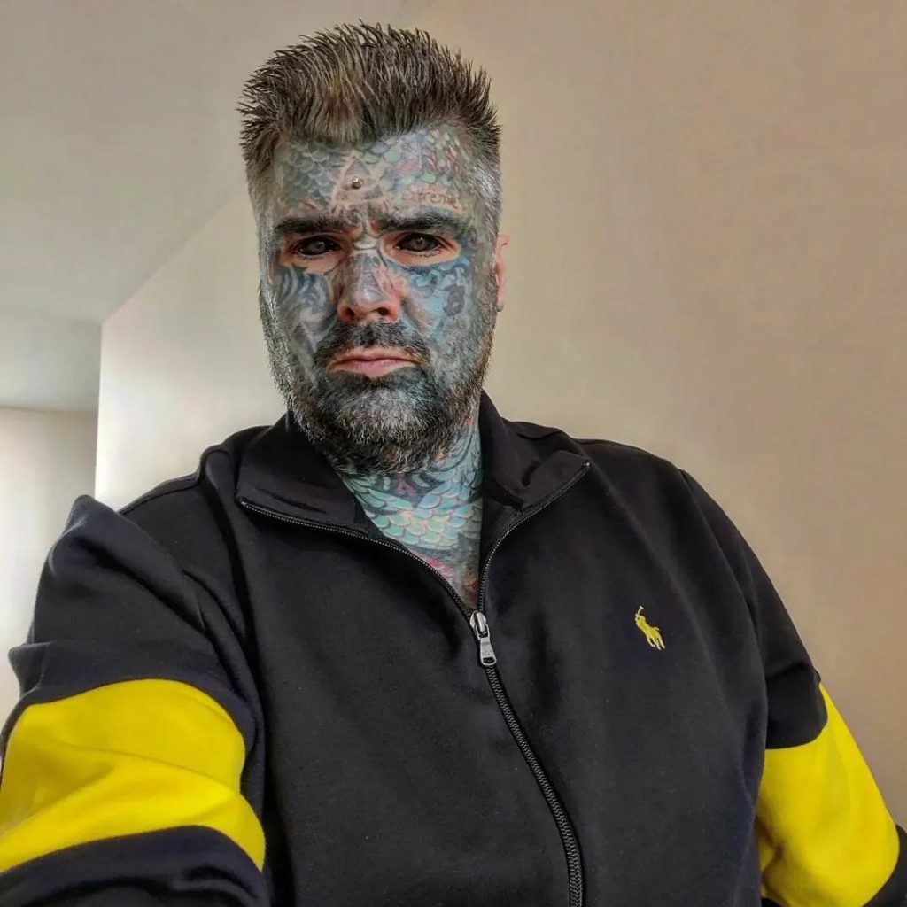 Britain’s most tattooed man faces daily judgment as people refuse to sit next to him on transport and secretly snap photos, but he refuses to let it hold him back.
