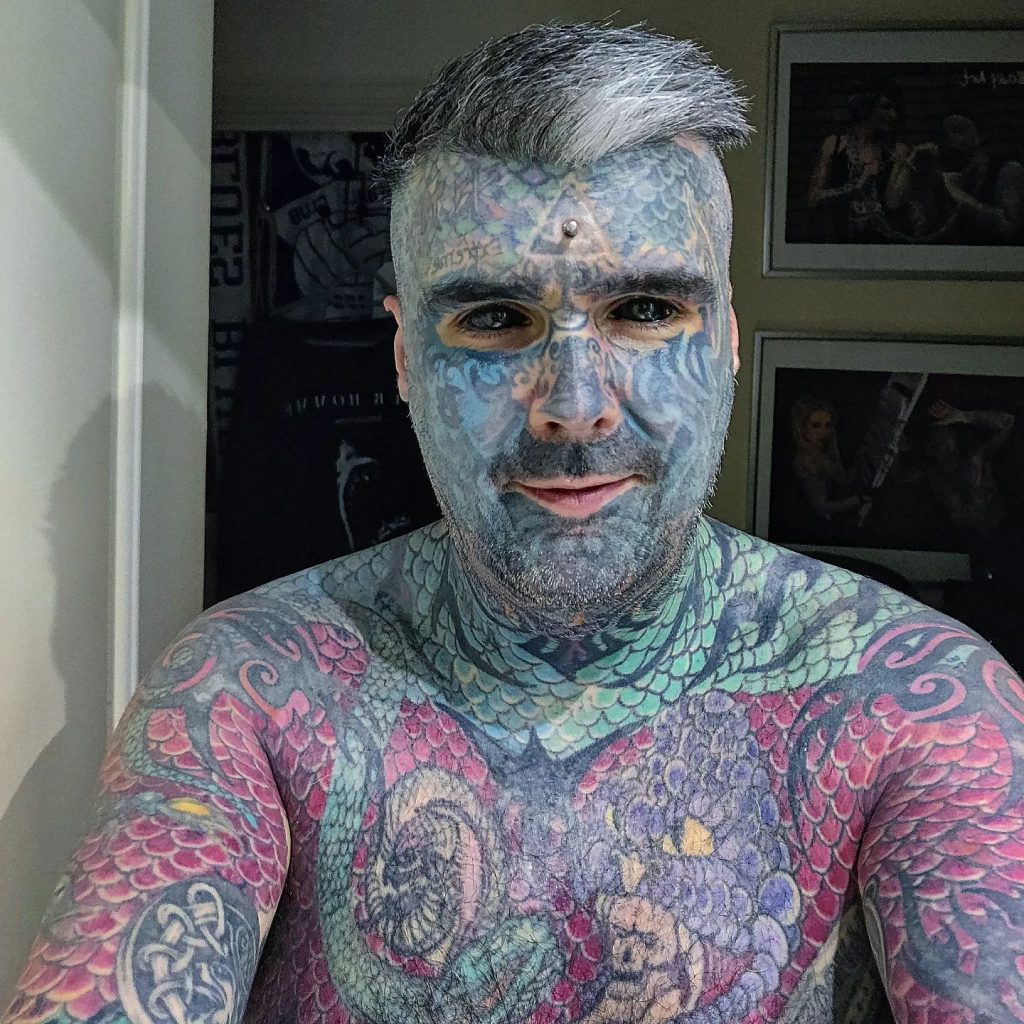 Britain’s most tattooed man faces daily judgment as people refuse to sit next to him on transport and secretly snap photos, but he refuses to let it hold him back.