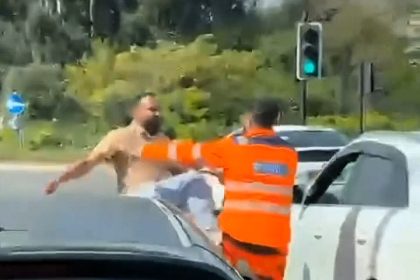 Angry driver throws punches at recovery worker in road rage brawl at Southall roundabout - onlooker films fight as bystander steps in to break it up.