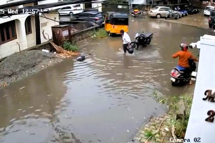 Biker risks electrocution to save boy shocked by live wire in flooded street - Kannan Tamizhselvan pulls child to safety and performs CPR learned from YouTube in heroic act.
