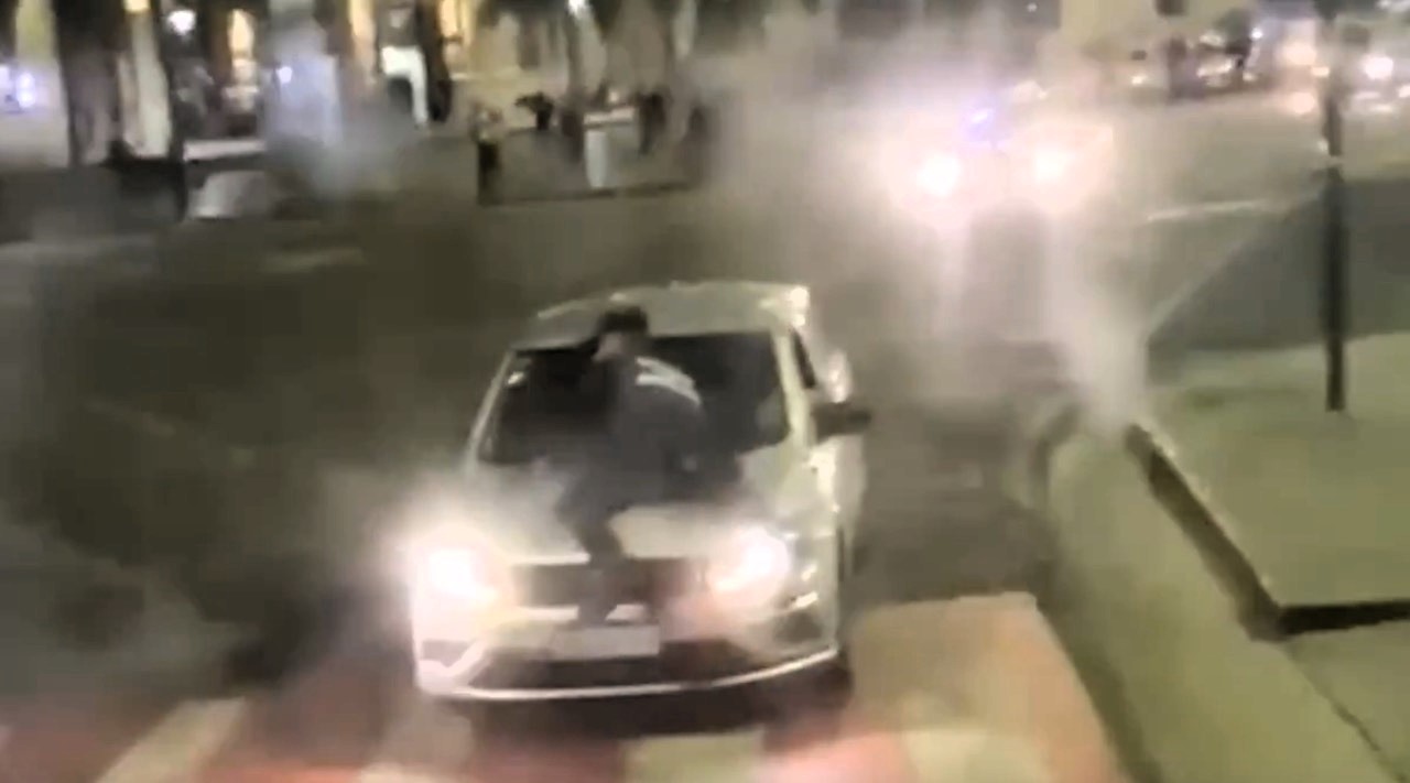 A taxi driver in Argentina fled a police stop with a child in the backseat, forcing a cop to cling to his bonnet for six blocks before being thrown off. Driver still at large.