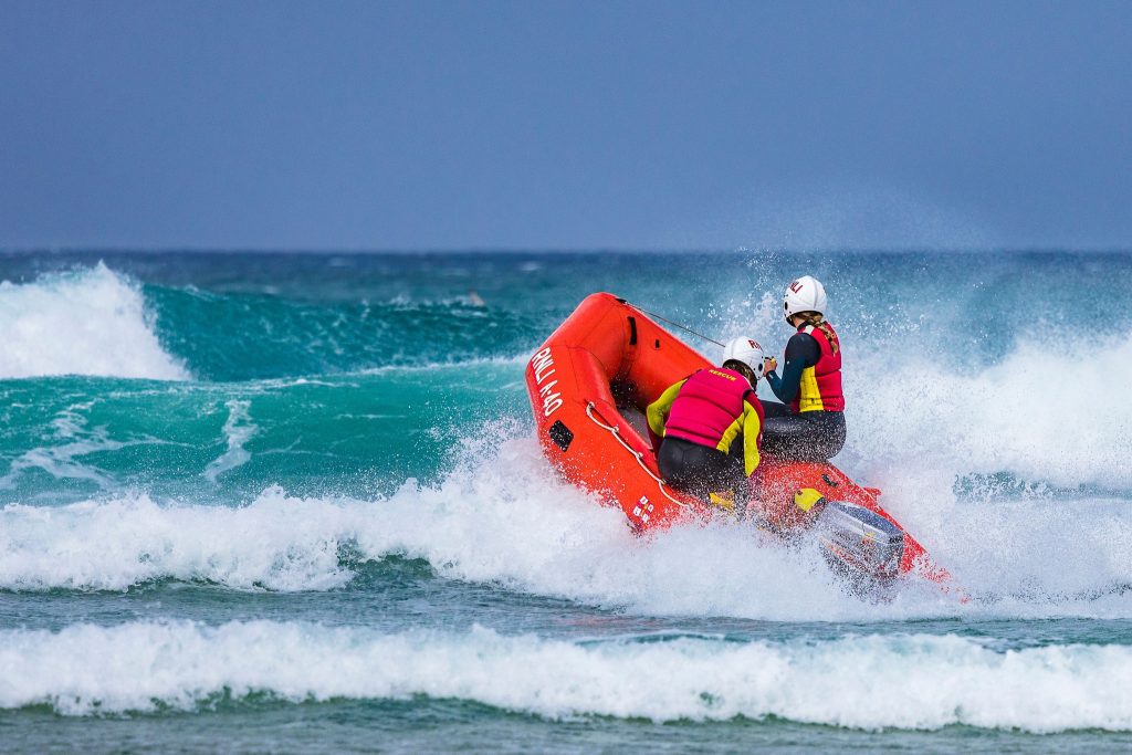 Off-duty RNLI lifeguards heroically save drowning man in rough seas at Praa Sands - team battles strong currents for 15 minutes in dramatic pre-season rescue.