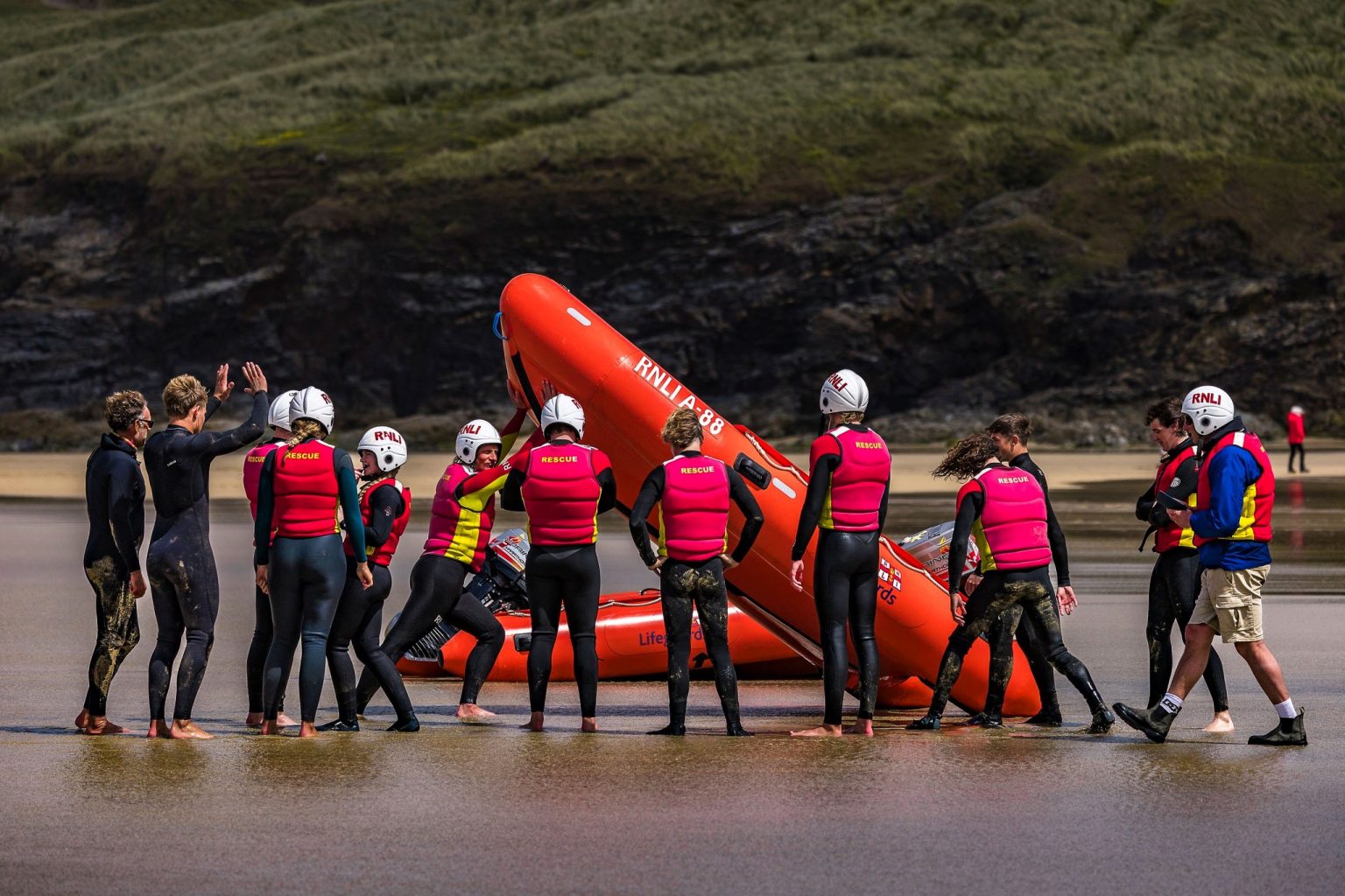 Off-duty RNLI lifeguards heroically save drowning man in rough seas at Praa Sands - team battles strong currents for 15 minutes in dramatic pre-season rescue.