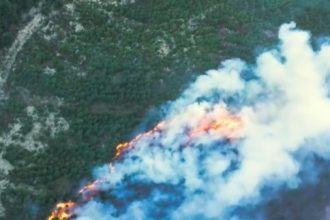 Drone captures raging wildfires in Northern Ireland's Mourne Mountains - over 50 firefighters battle blaze near Bloody Bridge as locals warned to stay away.