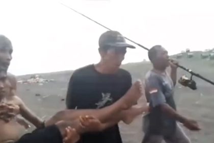 A fisherman and drone operator rescue swimmer swept 1,300 feet out to sea in Java using a foam lid and fishing line - the TikTok video goes viral with 13.6m views.