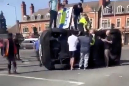 A police officer was hospitalized after a crash in Birmingham while responding to an emergency. The van flipped on impact but her injuries were not life threatening.