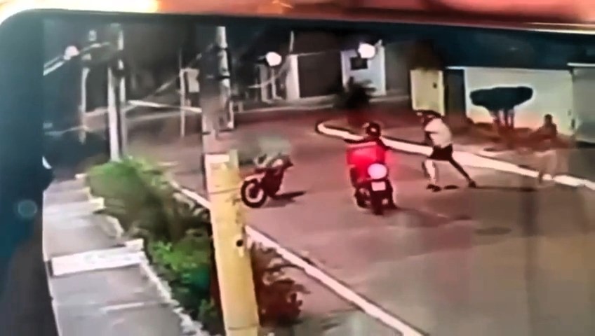 A man in Nova Iguaçu, Brazil, was left in just his underwear after armed thieves stole his bike and shorts during a shocking street robbery caught on CCTV.