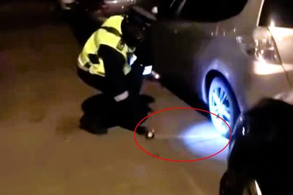 Traffic warden measures car's distance from curb at 3am to issue ticket - shocked locals react as vehicle found 50cm out in Northampton, breaching parking law.