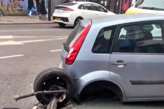 Ford Fiesta loses entire rear axle on busy Peckham High Street - stunned locals joke about ‘Boycie’s special offer’ as police help move broken car