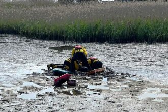 Two children were rescued after getting trapped chest deep in mud in Mudeford, Dorset. Cold and exhausted, they were saved by RNLI crew and treated by paramedics.