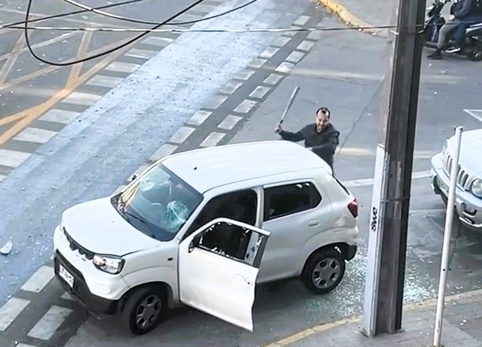 A parking dispute in Santiago, Chile, escalated into a violent road rage attack as two drivers smashed each other's cars with a bat and tree branch, leaving both vehicles wrecked.