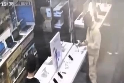 Two teens dubbed Britain's dumbest criminals were caught on CCTV kicking phones in a Currys store during a failed robbery attempt that left devices damaged but intact.
