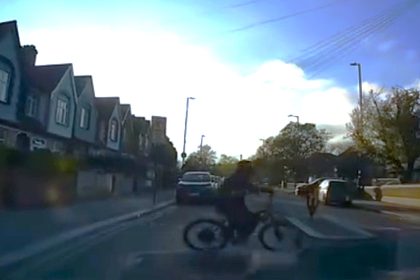 An e-bike thief snatched a phone from a pedestrian near Tottenham's stadium in a brazen broad daylight theft caught on dash cam just 200m from the ground.