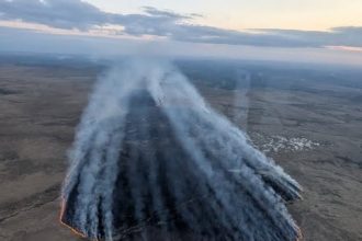 Firefighters are battling a huge Dartmoor wildfire sparked by Britain’s driest spring with flames stretching miles and warnings issued to avoid the area.