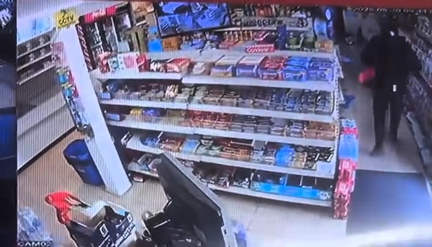 A robber with a handgun stormed a Holt Heath Post Office, threatened staff and fled with cash. Police seek help identifying him and a grey Renault Clio seen nearby.