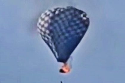 A man died after rescuing two others from a burning hot air balloon at a Mexico festival - he fell from the sky while dangling from a rope as flames engulfed the basket.