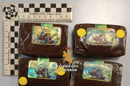 A tourist in Spain tried bribing police with £8,500 each after drugs marked with Donald Duck and Mickey Mouse were found in his hotel room - he was arrested with fake ID.