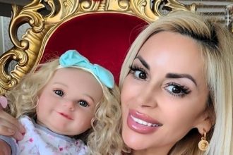 Influencer Marcela Iglesias, known as the Human Barbie, bought a reborn doll to ease empty nester syndrome after her son grew up, calling it a comforting emotional companion.