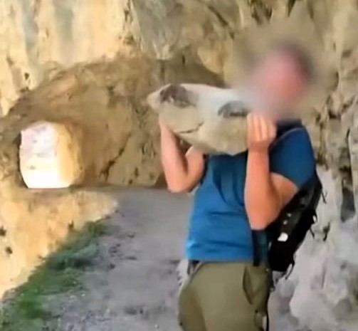 A tourist faces a £168,000 fine after throwing a huge rock into a gorge at Spain's Cares Trail - a reckless act that sparked outrage and police investigation.