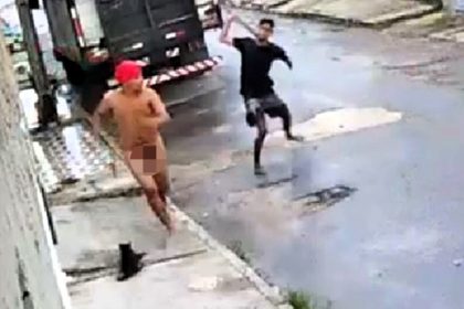 A naked man in a red shower cap sparked chaos in Brazil after taunting locals and being chased with sticks and stones before vanishing before police arrived.