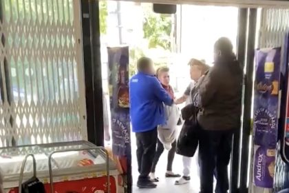 A woman accused of theft clashed with a Tesco worker in a dramatic street scuffle outside a North London store as shocked shoppers watched the chaos unfold.
