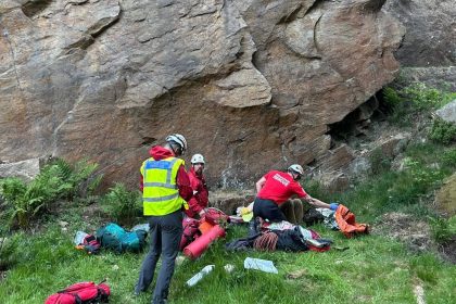 A mountain rescuer fractured his spine in a fall and had to be saved by his own team - who found out mid-mission the injured climber was one of their own.