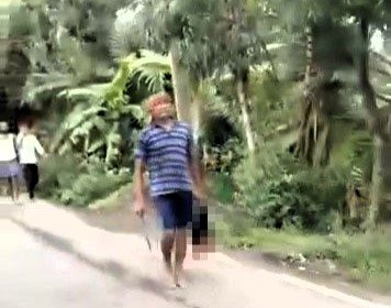 A man in India is accused of beheading his sister-in-law during a family dispute, then parading her severed head through town before being arrested by police.