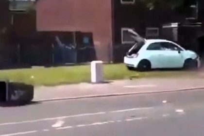 A Fiat 500 reversed wildly during Salford disorder as 60 youths clashed with police, set fires, and blocked roads. Multiple arrests were made, with a dispersal order in place.