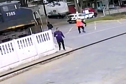 Elderly woman survives being hit by train in Brazil after trying to cross tracks too late, suffering serious injuries despite driver’s emergency brake and warning horn.