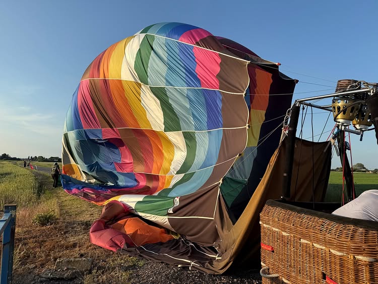 A hot air balloon pilot got a lighthearted warning from police after landing on a rural Cambridgeshire road, with officers joking about parking and insurance.